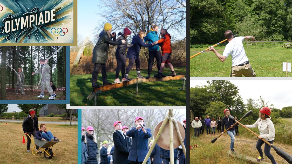 På billedet ses teambuilding-aktiviteter arrangeret af firmaet Olympiade. Deltagerne engagerer sig i forskellige udfordringer, herunder at kæmpe med polstrede stænger, spydkast, bueskydning, præcisionsskydning og balancering på en træplanke. Disse aktiviteter er designet til at fremme samarbejde og kommunikation i en sjov og naturskøn udendørs setting.
